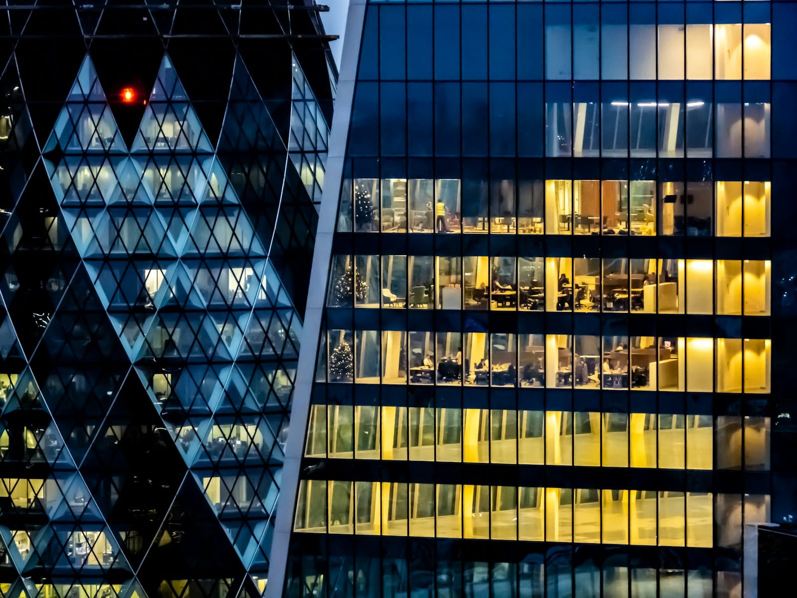 A high-rise facade in close-up, windows repeating in a tight grid.