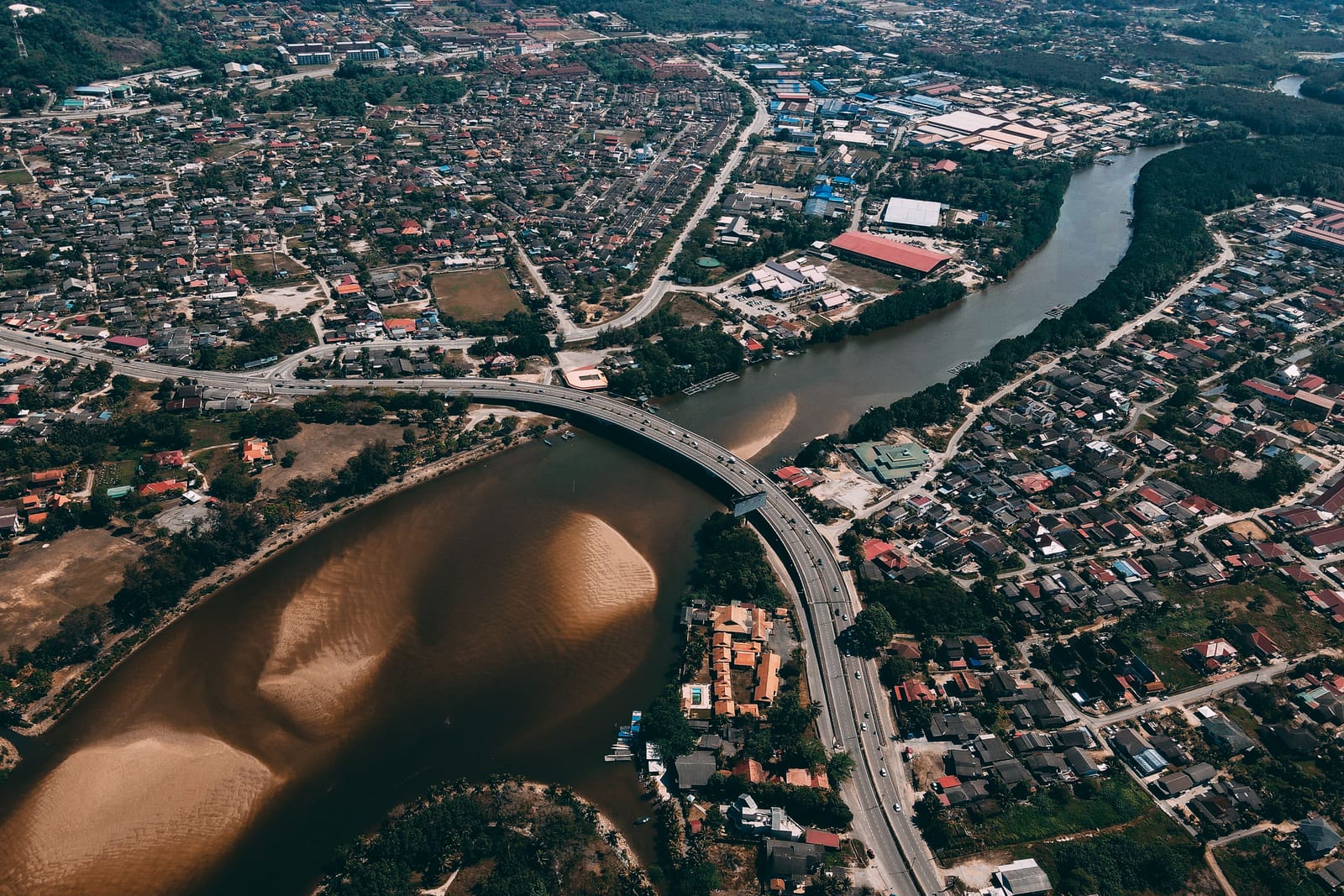 A river dividing a city in two, seen from high altitude.