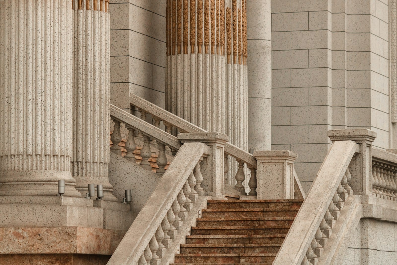 A stone staircase flanked by classical columns.