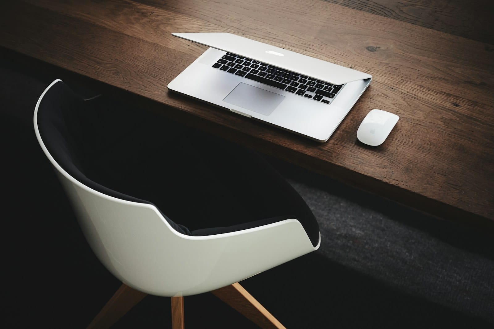 A clean desk workspace with a laptop.
