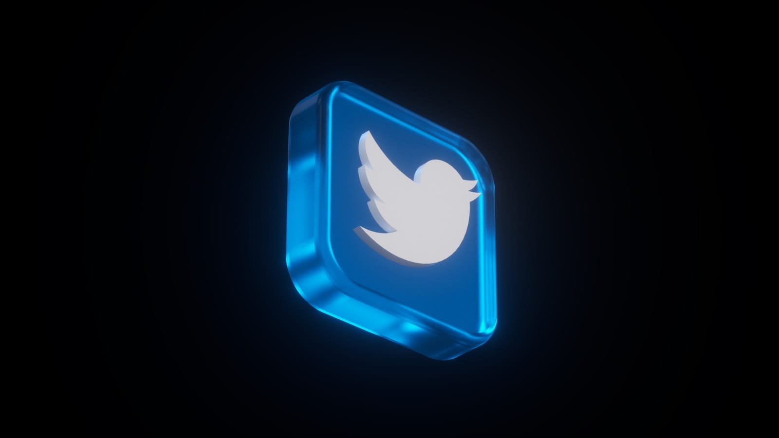 The Twitter (X) logo glowing on a dark background.