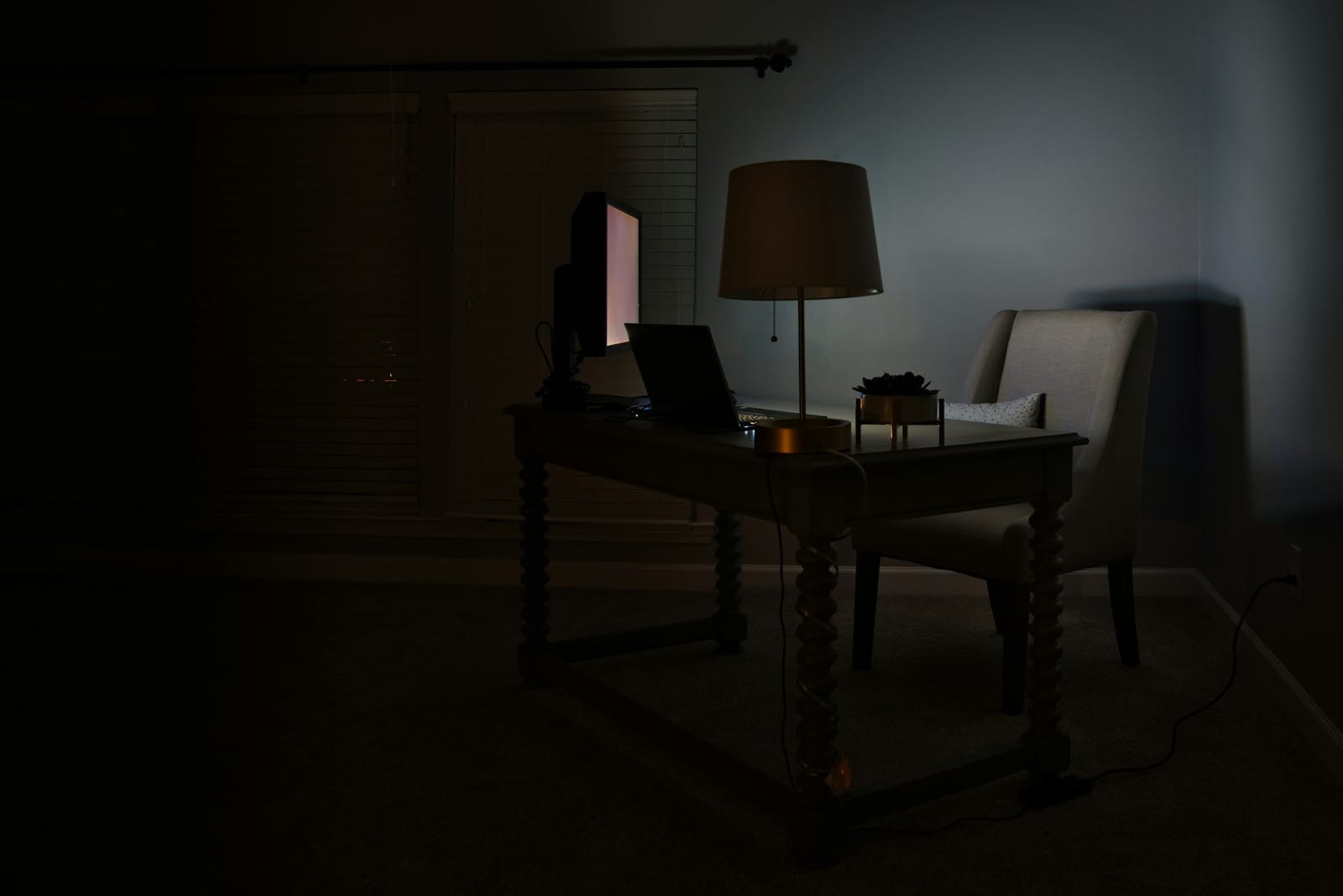 An analyst reviewing data across two screens.